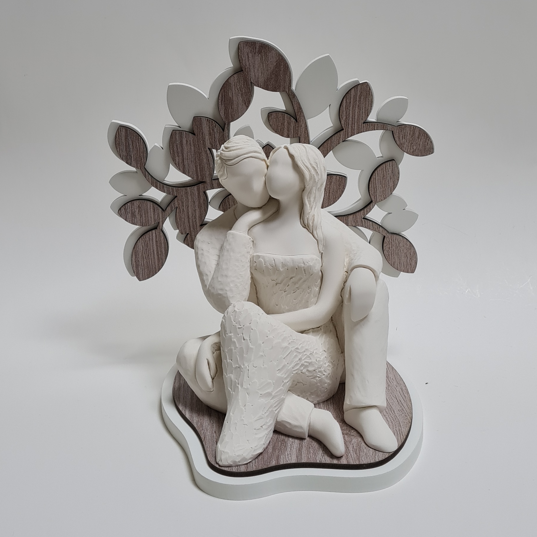 Scultura sogno innamorati seduti